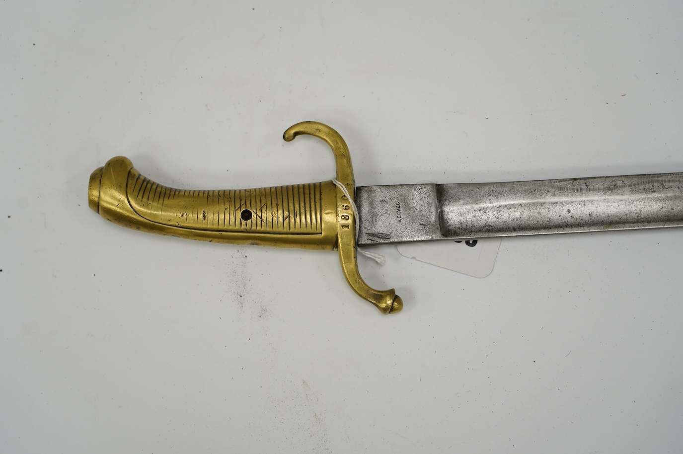 A composite short sword, British military blade by Reeves with Continental brass hilt, blade 66.5cm. Condition - fair